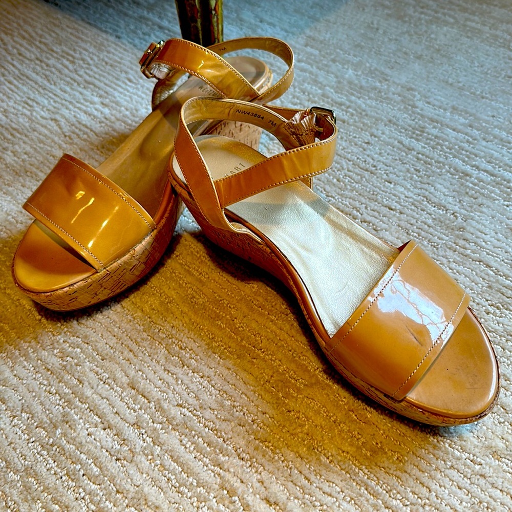 Stuart Weizmann natural color patent leather cork platform.   Used condition